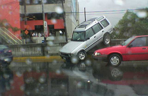 Note to self: Do not allow the intern to parallel park the Range Rover ever again. Photo Courtesy: Eperales